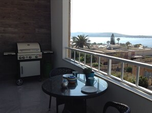 Outdoor dining - LUXURY SEAFRONT APARTMENT WITH POOL (Saint Paul's Bay)