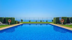 A swimming pool with a clear view of the sea in the background. - Apt 401 Luxury Serv Aparts-Estepona, 3 Bed, Heated 20m Pool, Jacuzzi - an Oasis (Estepona)