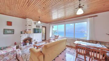 Family Apartment, 3 Bedrooms, Kitchen, Sea View | Living area | 42-inch flat-screen TV with satellite channels, LED TV, table tennis