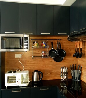 Fridge, microwave, stovetop, coffee/tea maker
