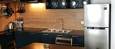 Fridge, microwave, stovetop, coffee/tea maker
