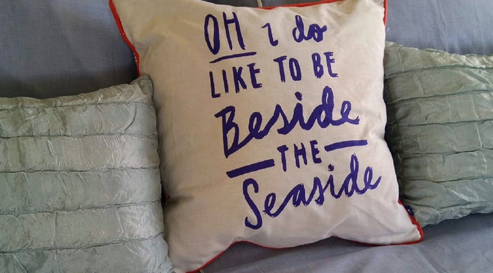 A pillow with text on it.