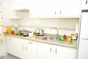 Fridge, microwave, coffee/tea maker, toaster