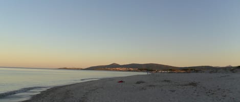 On the beach, sun loungers, beach towels
