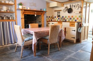 The Kitchen with the antique Rayburn & slate floor