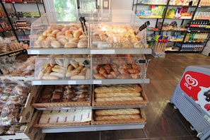A bakery display with various baked goods.