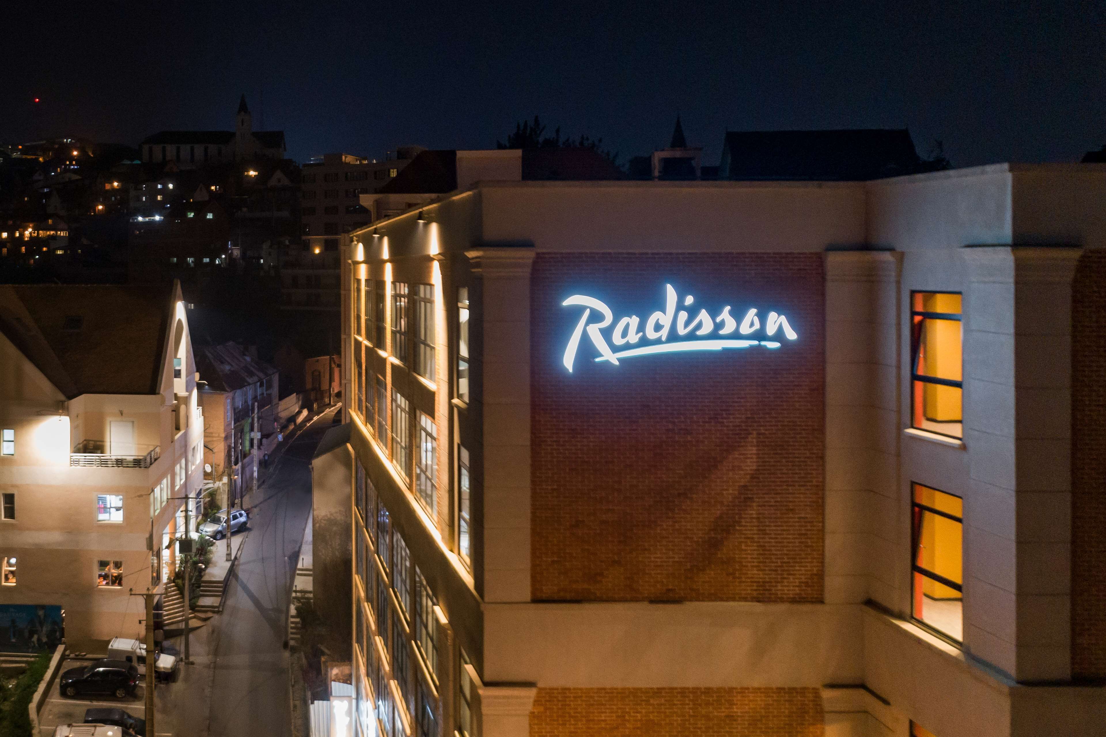 A building with a neon sign reading "Radisson."