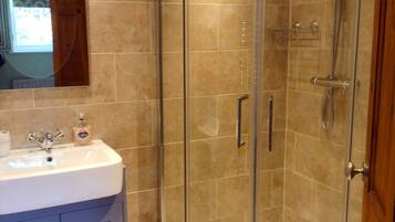 Shower, hair dryer, towels, toilet paper