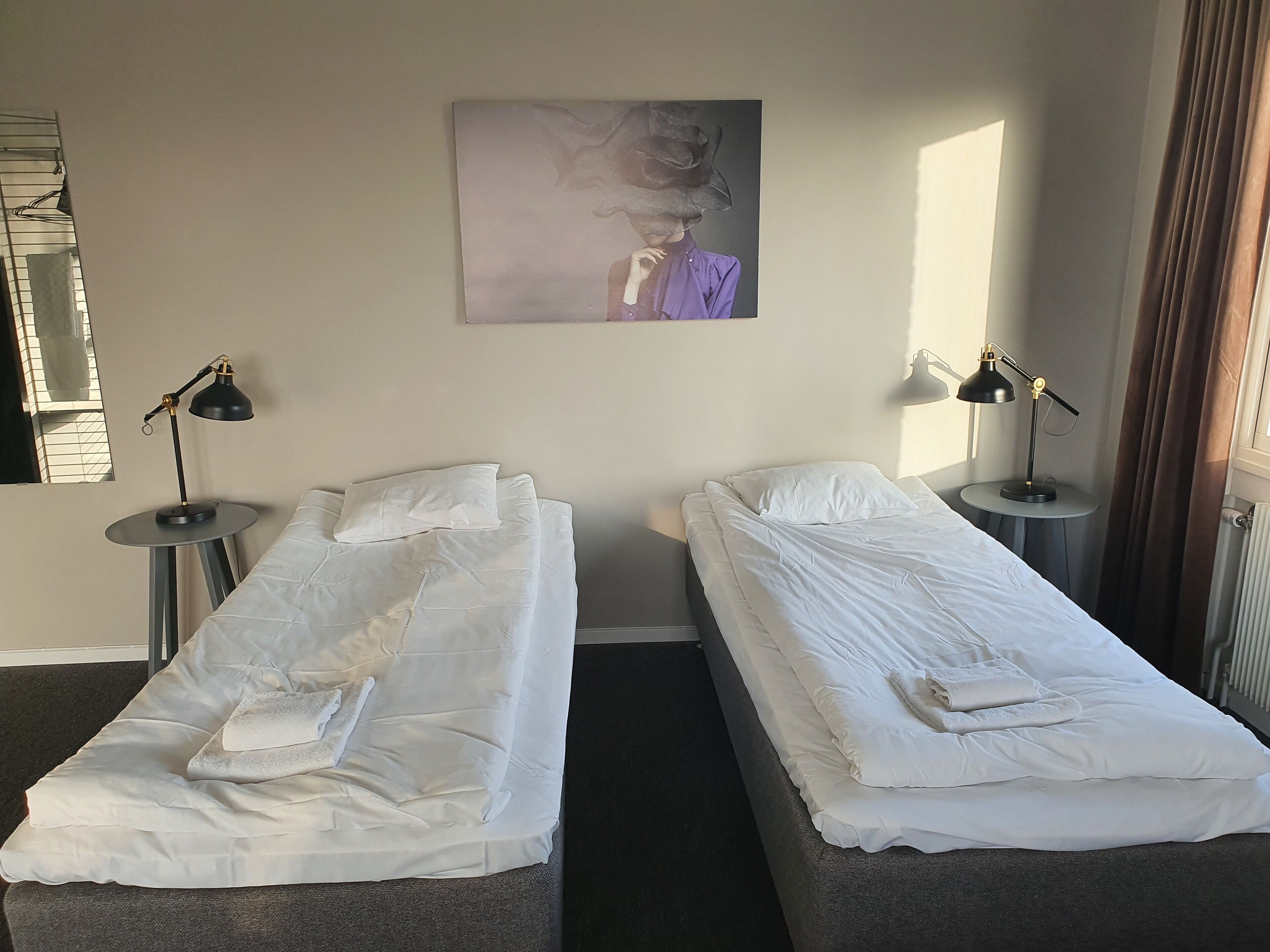 family room (shared bathroom) | desk, blackout curtains, iron/ironing board, rollaway beds