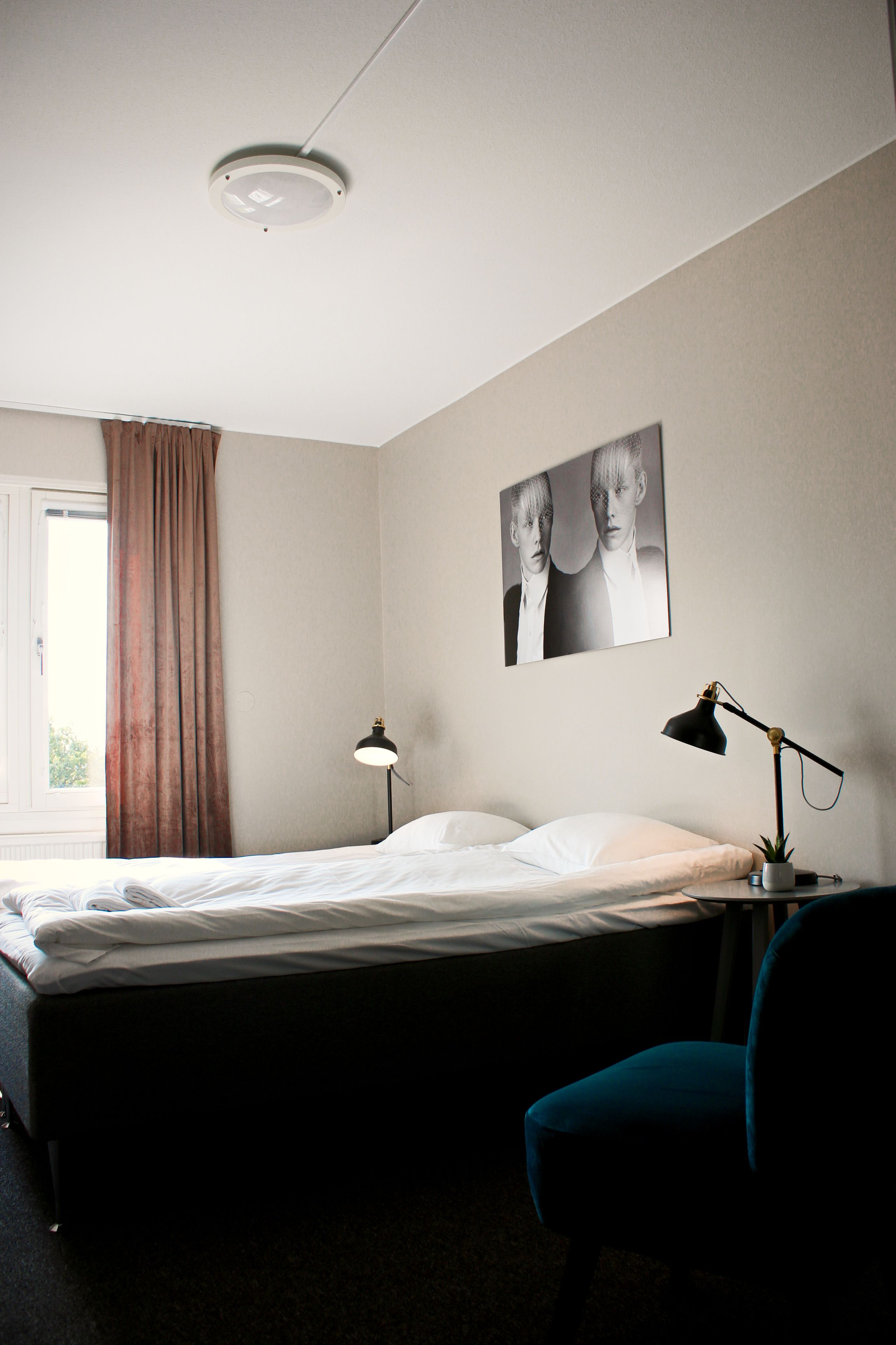 twin room (private bathroom) | desk, blackout curtains, iron/ironing board, rollaway beds