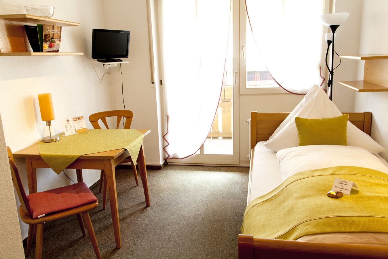 single room | living area | flat-screen tv