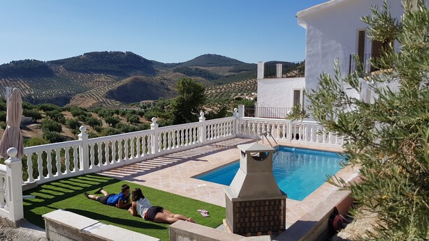 A pool area with a view of the countryside, a white building, and a white fence. - Mansion Alba "a dream" (Alcaudete)