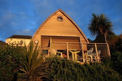 Feet in the water, wooden house with terrace, breathtaking sea view.