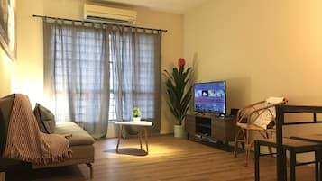 Apartment, 3 Bedrooms | Living room | Flat-screen TV