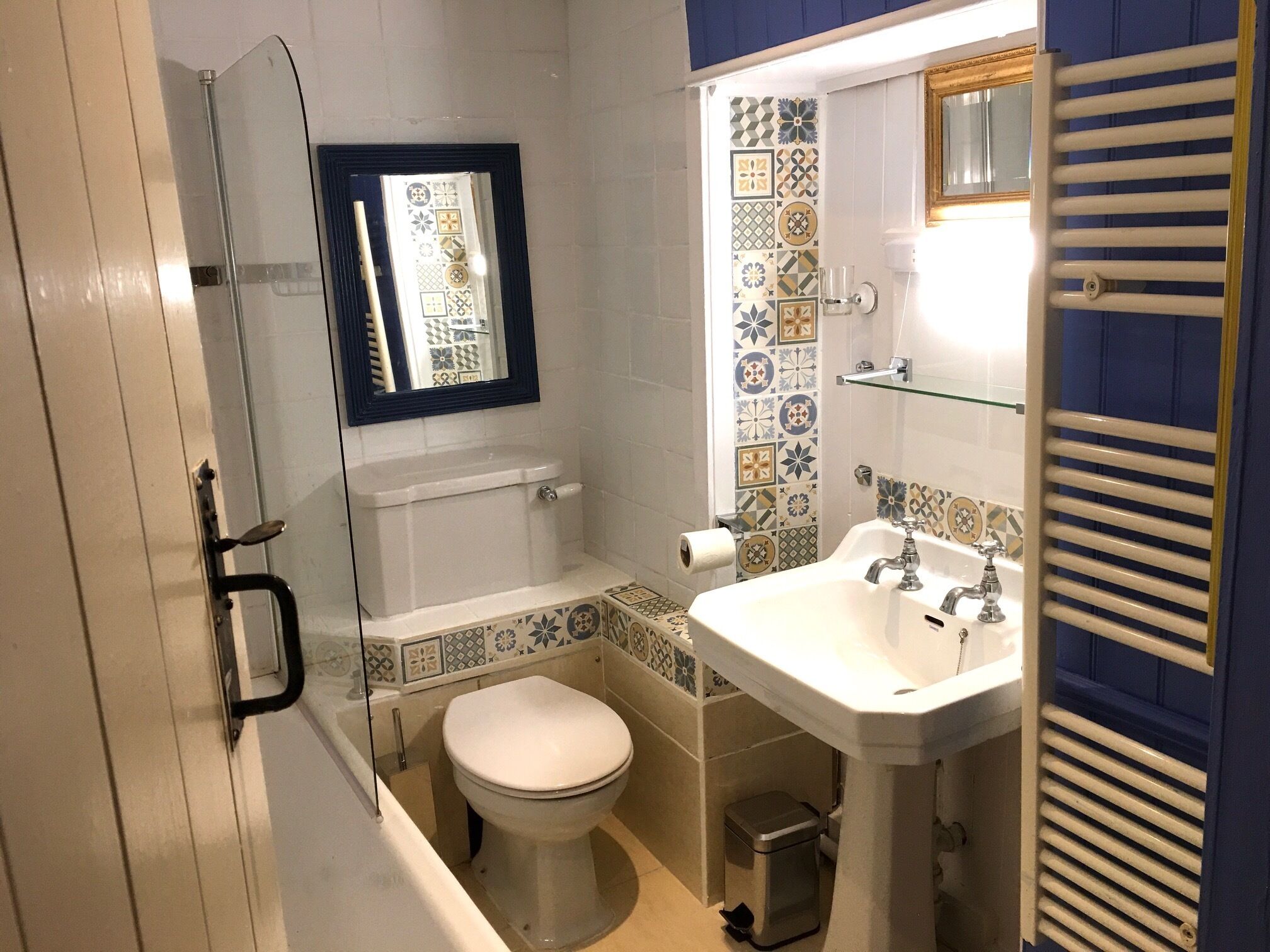 Combined shower/tub, hair dryer, soap, toilet paper
