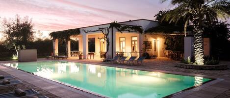 Outdoor pool, an infinity pool, sun loungers