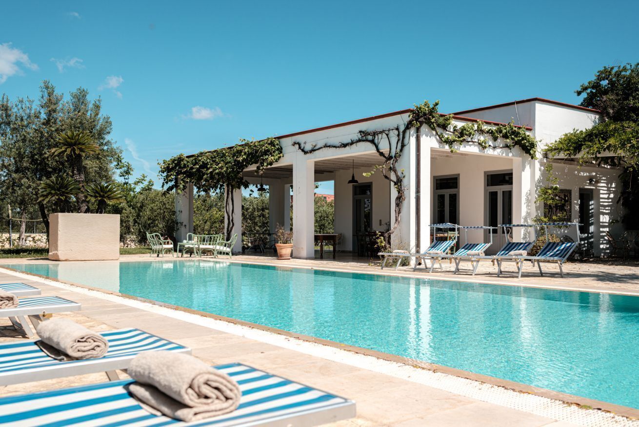 An infinity pool, pool loungers