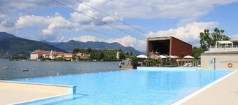 Apartment in stone chalet surrounded by greenery a few steps from the lake