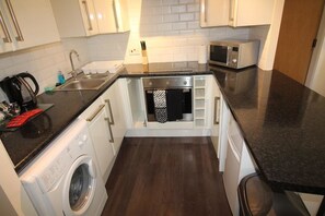 1 Bed Apartment | Private kitchen | Microwave, oven, stovetop, coffee/tea maker