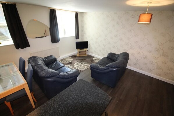 1 Bed Apartment | Living room | Flat-screen TV