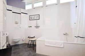 Combined shower/tub, hair dryer, towels, soap