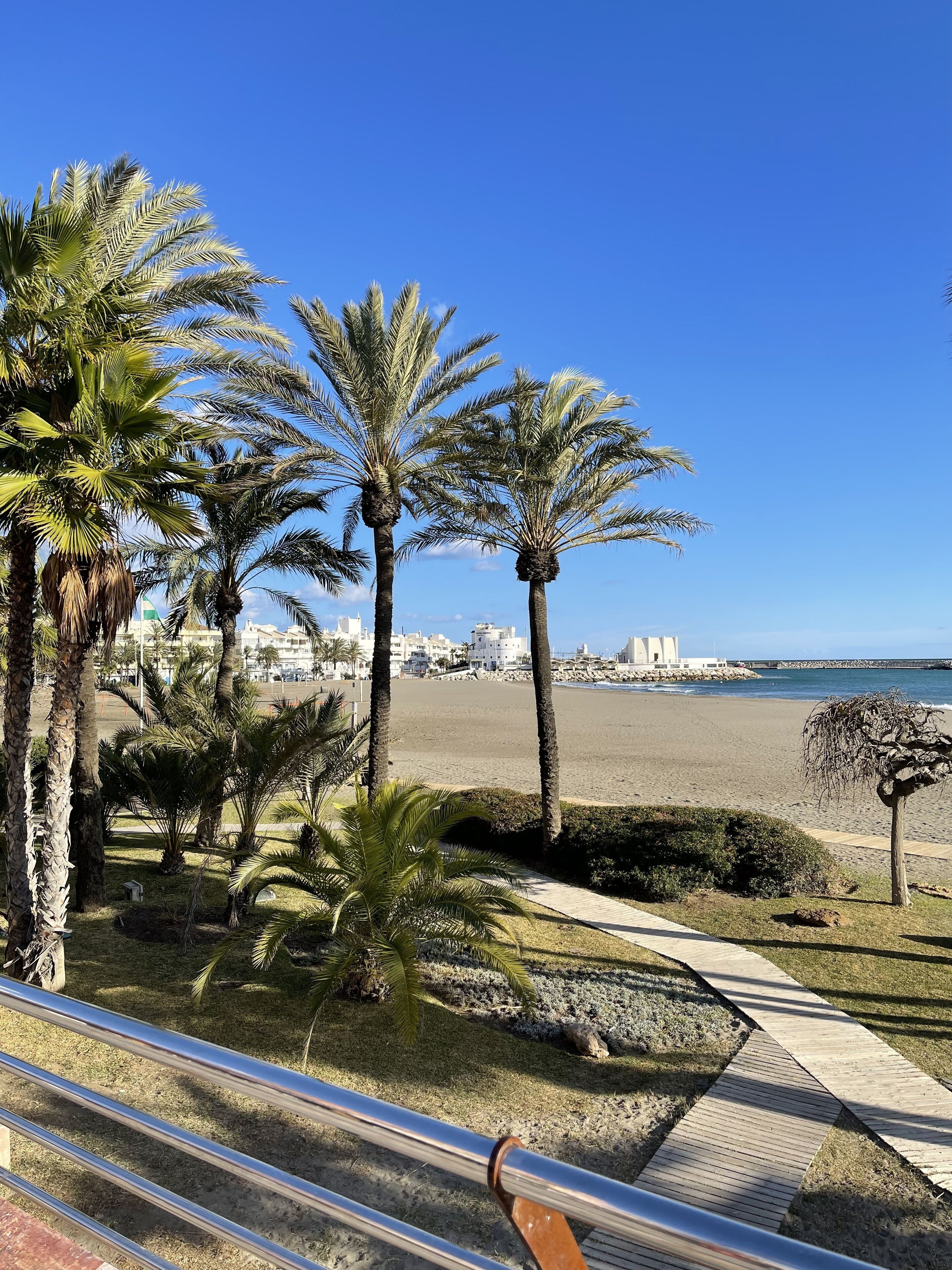 On the beach, sun-loungers