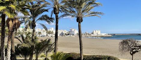 On the beach, sun-loungers