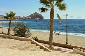 On the beach, sun loungers, beach towels