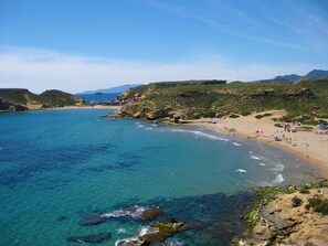 On the beach, sun loungers, beach towels