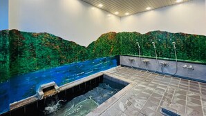 A spa area with a wall mural of a forest, a hot tub, and a shower area. - Sachinoyu Hotel Shiga Kogen (Yamanouchi)