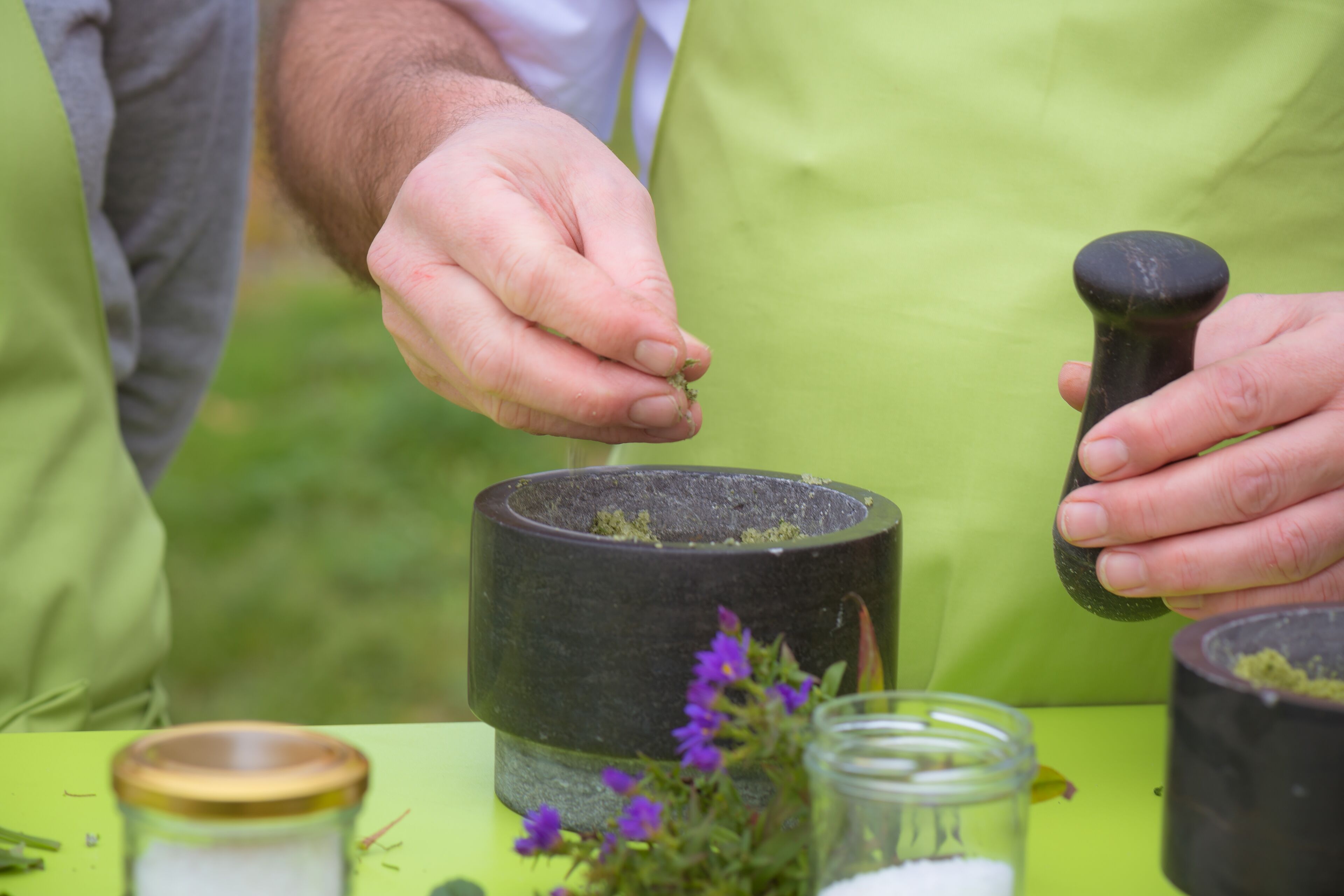A person using a mortar and pestle.