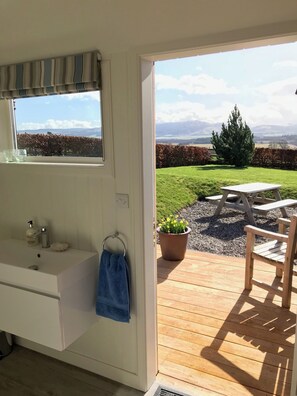 A bathroom with a sink, mirror, and towel rack. - Award-Winning 5 Star Luxury Private Retreat - Hot Tub, Tennis, Fishing, Horses (Auchterarder)