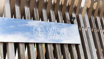 A sign for Shiden Terrace at Shonan Hotel.