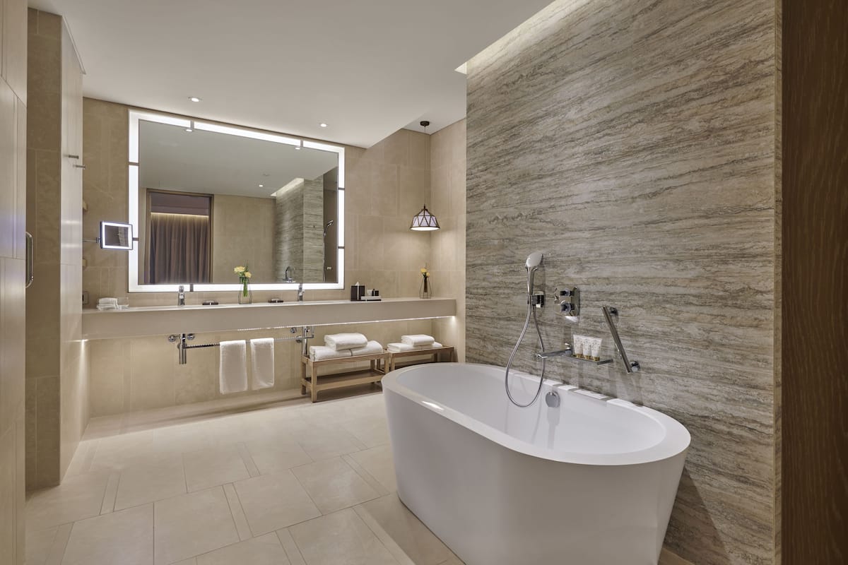 separate bathtub and shower, deep-soaking bathtub, rainfall showerhead