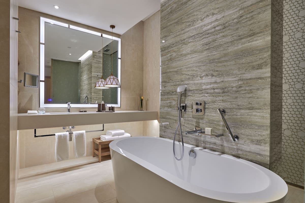 separate bathtub and shower, deep-soaking bathtub, rainfall showerhead