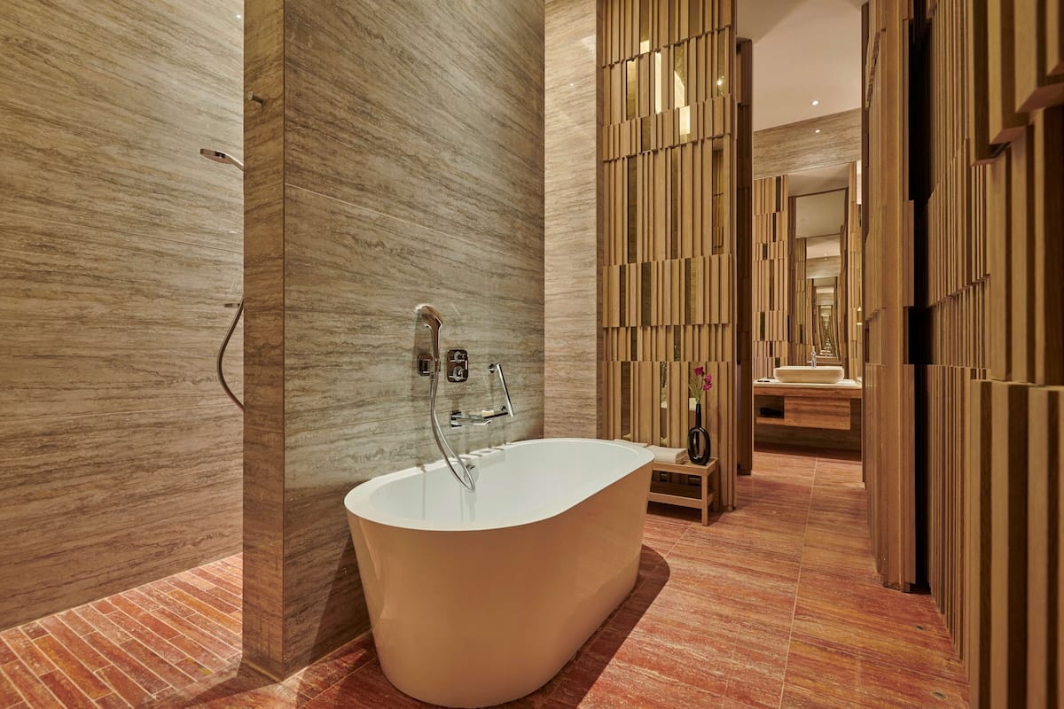 separate bathtub and shower, deep-soaking bathtub, rainfall showerhead