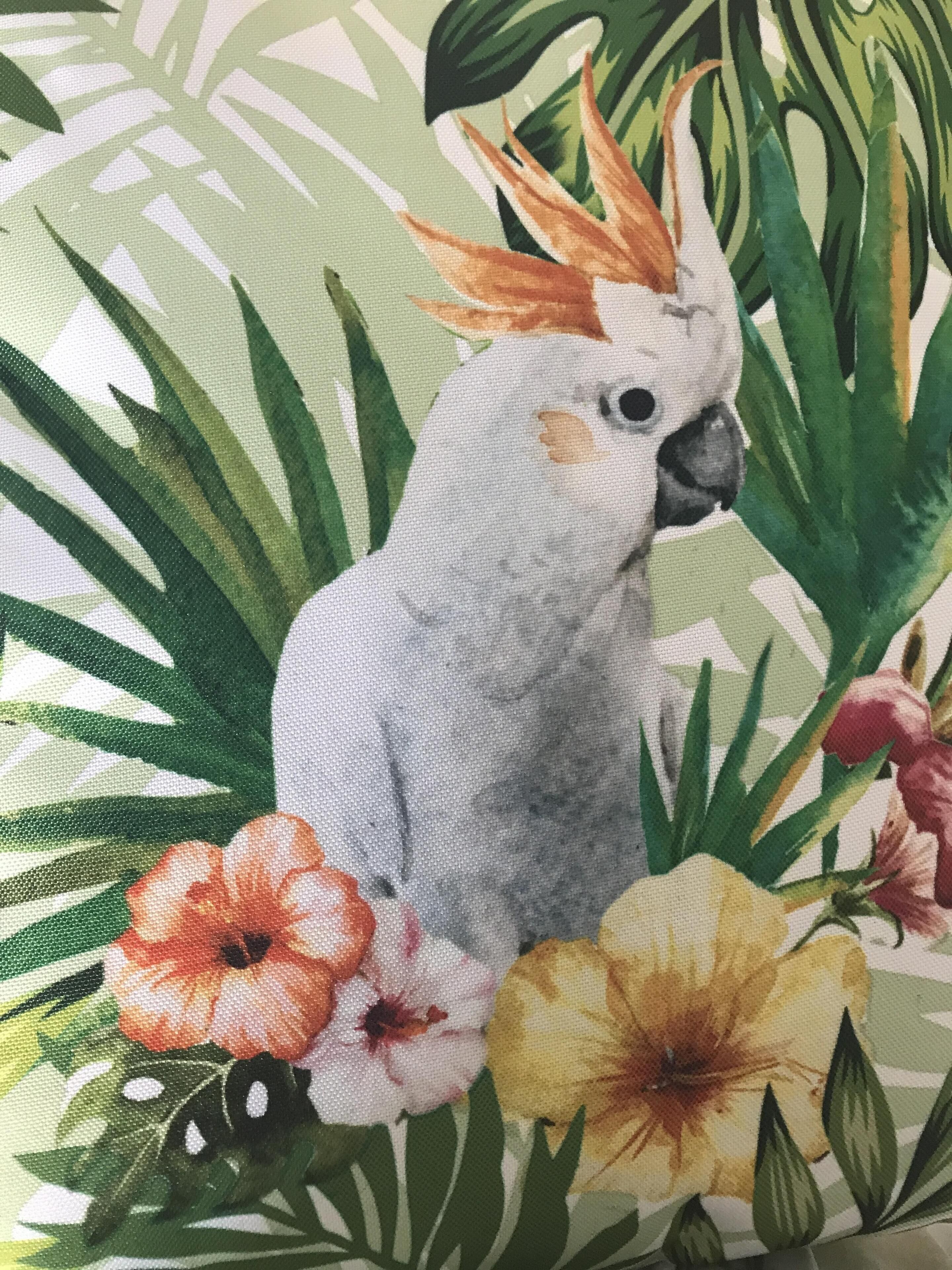 A painting of a cockatoo with flowers and leaves.