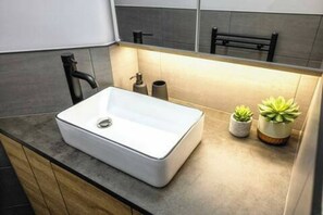 Bathtub, hair dryer, soap, shampoo