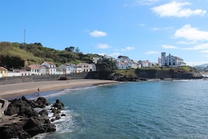 Overlooking the beach, this charming town features a historic church with a bell tower.