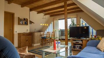 Platt-tv, dvd-spelare, böcker och en stereo