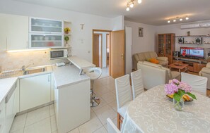 Fridge, stovetop, dishwasher, coffee/tea maker