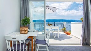 A balcony with a table and chairs, a potted plant, and a view of the sea. - 3 bedroom nice home in Stanici (Stanici)