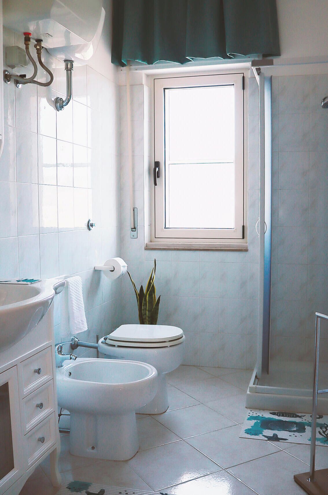 Shower, hair dryer, towels, toilet paper