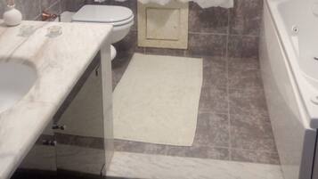 Combined shower/tub, jetted tub, hair dryer, bathrobes