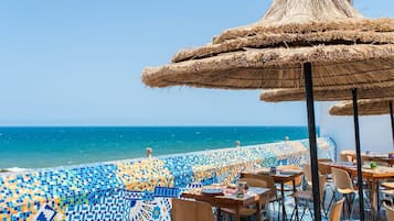 Breakfast, lunch, dinner served; local cuisine, sea views