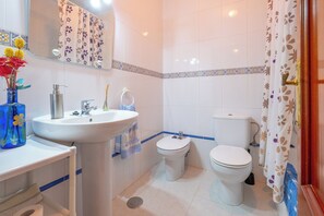 Bathtub, hair dryer, towels