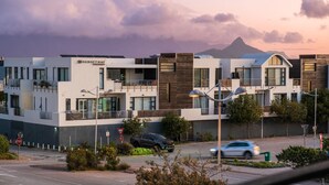 A modern building with multiple balconies and a stop sign. - Eden on the Bay 108 (Cape Town)