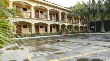 A multi-story hotel with a courtyard.