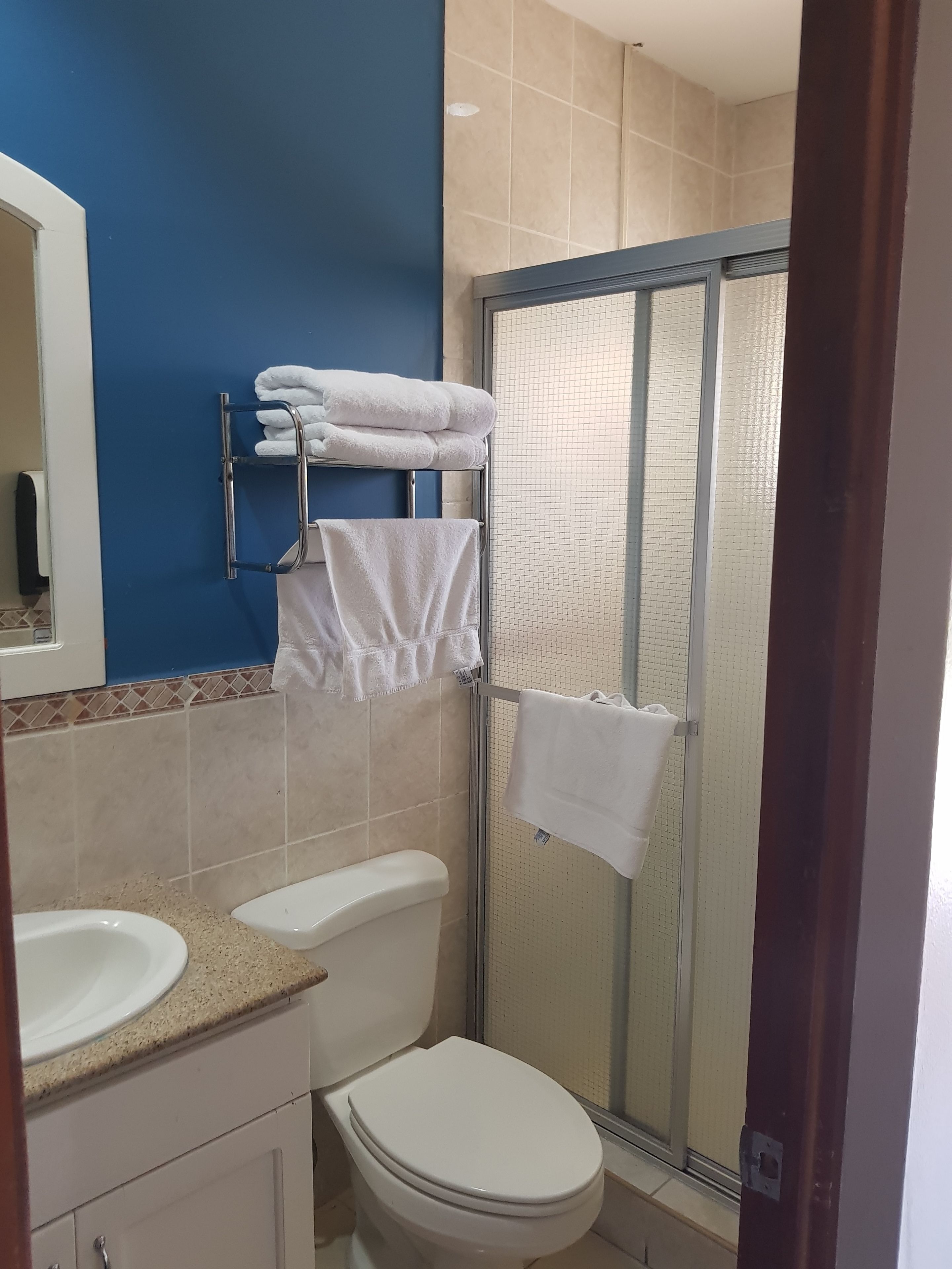 classic quadruple room | bathroom | shower, hair dryer, soap, shampoo