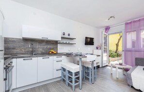 Fridge, stovetop, dishwasher, coffee/tea maker